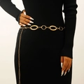 Detail of a vintage golden geometric fringe waist chain belt on a black dress - Geometric Ring Style (5799)