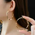 Large golden irregular wavy hoop earrings with minimalist metallic texture for women - Fashion Gold Irregular Wave Texture Large Hoops