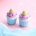 Close-up of two resin cupcakes with purple frosting and blue bases for DIY crafts - Large Raspberry Cupcake - Blue Base