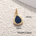 Macro detail of 18K gold-plated teardrop pendant with blue zircon stone, 16mm x 8mm - Deep Blue Water Drop