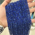 Lapis lazuli faceted small beads in deep blue for jewelry making held in hand - Grade B Lapis Lazuli 3mm