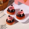 Detailed macro view of 1.3cm miniature resin chocolate cake with pink cream topping - Blueberry Chocolate Cake