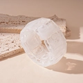 Macro detail of modular white marble acrylic bracelet with artistic smoky resin patterns - White