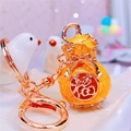 Gourd keychain with lucky Fu character in vibrant orange and gold metal finish - Yellow Lucky Gourd
