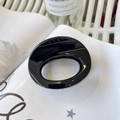 Sleek black oval hair claw clip with glossy finish shown in a minimalist setting - Approx 7cm / Glossy Black