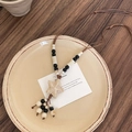 Detail view of ethnic starfish pendant with textured beads on wooden background - 5# Necklace-White