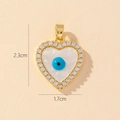 Golden heart pendant with evil eye and white enamel finish, size 2.3cm by 1.7cm - Gold Heart Central Evil Eye Enamel Pendant (15)
