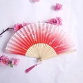 Pink gradient bamboo folding fan with butterfly and flower patterns plus a tassel - Red & Pink Gradient Floral Butterfly Style (Women's Fan-20)