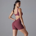 Detailed back view of backless yoga bodysuit in dark rose red with scrunch butt detail - Burgundy