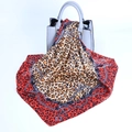 Leopard print satin square scarf with orange borders and chain patterns on a handbag - Red Edge Chain Leopard