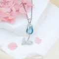 Silver tulip necklace with blue opal stone and zircon accents on a white stone base - Light Blue Cat Eye Necklace / Silver