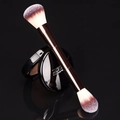Dual-headed makeup brush with rose gold handle and gradient bristles on black background - Medium Double-ended Brush