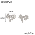 Detail view of silver bow earrings measuring 2.5cm by 2.1cm with a 5.5g weight - BE47721AW0 Silver Fluid Bow