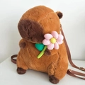 Plush brown Capybara backpack with pink flower and adjustable shoulder straps - Holding Pink Flower (Webbing Strap)