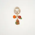 Detail of alloy Capybara keychain with orange persimmon and cute backpack bear charms - Backpack Bear With Persimmon (Capybara#05)