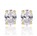 Detailed macro view of oval cut clear gemstones set in classic gold four-prong studs - 925 Silver / Gold/Zirconia