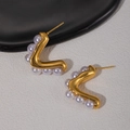 Macro detail of elegant gold-toned wavy pearl earrings on a reflective tray - Wavy Mirror Finish Pearl Hoop (#0906)