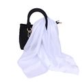 Detail of elegant white satin silk scarf tied on a black leather handbag handle - One Size / Faux Silk Satin / White