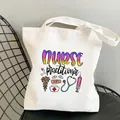 Nurse practitioner themed white canvas tote bag with medical icons on a black chair - Style C14 (No Inner Pocket/No Zipper)
