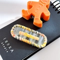 Cute acetate hair clip with orange knit edge and yellow letter detail on transparent base - Oval-Transparent