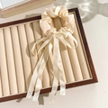Beige floral lace scrunchie with long ribbon bow on a jewelry tray for a vintage look - White Ribbon Style