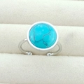 Detail of adjustable silver ring with a large round turquoise stone in a jewelry box - 12mm Round - Turquoise