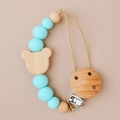 Blue silicone and wood bead baby pacifier clip with a bear charm and metal clasp - Green
