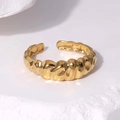 Detailed macro view of gold-plated stainless steel ring with wavy textured finish - Adjustable / Gold