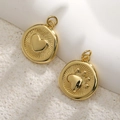 Golden round pendants with embossed heart and paw patterns on textured radial background - Double-Sided Gold Paw