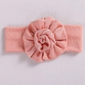 Pink handmade infant headband with a large soft fabric flower on a textured surface - Light Pink