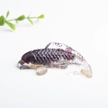 Deep purple crystal resin koi fish figurine with gold foil flakes on white background - Garnet