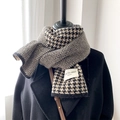 Detail of knit wool scarf featuring classic black and white houndstooth and herringbone patterns - Houndstooth Black