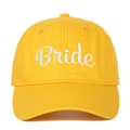 Close-up of white cursive Bride embroidery on a vibrant yellow cotton baseball cap - Bride (BRIDE) / Yellow