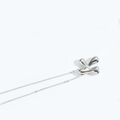 Polished silver liquid metal letter K pendant on minimalist thin chain necklace - Letter K