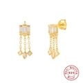 Detailed macro view of S925 sterling silver tassel earrings with zircon and gold plating - Chain Tassel