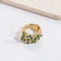 Detail view of gold multi-layer wrap ring featuring clustered green round gemstones - Multilayer Green Zirconia (Gold)