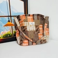 Detail view of floral canvas tote bag featuring vintage patchwork in brown and orange tones - Orange Coffee Ethnic Style