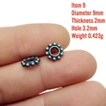 Macro shot of 9mm antique silver spacer bead held by fingers for jewelry making - 9# (9x2mm)