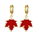 Detailed close-up of golden hoop earrings featuring delicate red maple leaf pendants - Red Maple Leaf