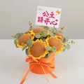 Handgehäkelter Sonnenblumenstrauß in einer lebhaften orangefarbenen Geschenkbox - Sonnenblume in Oranger Geschenkbox