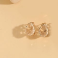 Macro detail of teardrop faceted crystal earrings with elegant gold plated settings - White Zirconia (Gold)