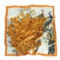 Detailed close-up of a peacock silk scarf featuring vibrant orange and blue feathers - Yellow Peacock