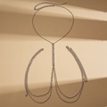 Detail of silver layered body chain featuring vertical white rhinestones on beige background - Silver