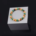 Natural turquoise and tiger eye stone beaded bracelet on a silver display stand - Multi Gemstone Mix