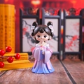 Close-up of cute cartoon girl figurines in purple and pink traditional Hanfu costumes - Daji