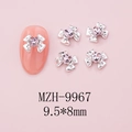 Detailed view of silver bow nail art with pink heart rhinestone, size 9.5x8mm - Silver Bow + Pink Heart Stone (9967)