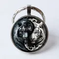 Silver keychain with yin yang tiger glass gem pendant featuring black and white tigers - Black and White Yin Yang Tiger