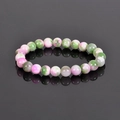 8mm natural stone bead bracelet with colorful polished texture on a dark mirror background - Rhodonite