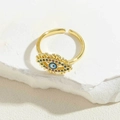 Goldener offener Ring mit bösem Blick, bunten Steinen und blauem Zentrum auf Stein - Gold-Königsblaue Emaille