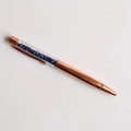 Detailed close-up of rose gold ballpoint pen featuring blue crystal fragments inside - Lapis Lazuli